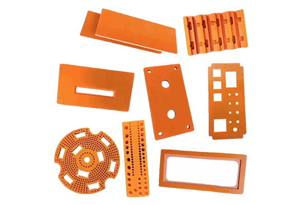How can chamfers and rounded corners be designed during insulation processing to mitigate the risks of corona and arcing in areas of concentrated high-voltage electric fields?